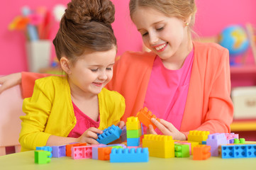 Wall Mural - girls playing with colorful blocks