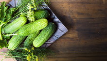 Fresh Cucumbers On A Wooden Table