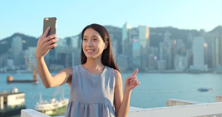 Poster - Woman making video call on cellphone in Hong Kong