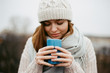 © Lyuba Burakova/Stocksy - Woman enjoying a cup of hot chocolate