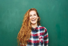 Portrait Of Red-haired Woman Smiling At Camera