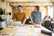 © Ivo de Bruijn/Stocksy - Two designers or creative professionals working in their studio or workplace