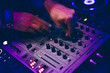 © Wells/Stocksy - DJ set: DJ hands and DJ desk