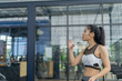© I Believe I Can Fly - Fitness woman in training drinking water after exercises in gym