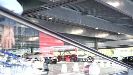 Wall Mural - Family going down escalator of shopping mall