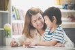 © lalalululala - Asian mother helping her son doing homework