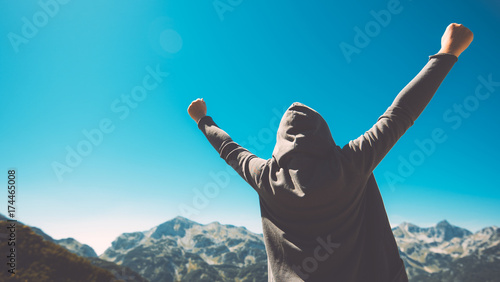 Cuadros en Lienzo Winning and success. Victorious female person on mountain top.