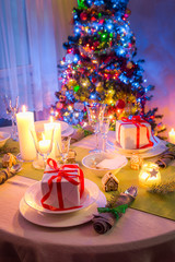 Beautiful Christmas table setting during the frosty winter evening