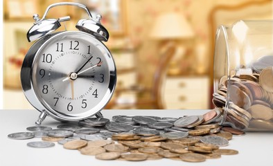 Canvas Print - Alarm clock  on coins.