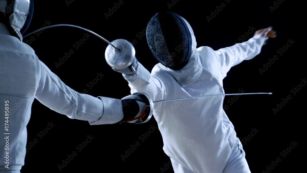 Two Professional Fencers Show Masterful Swordsmanship in their Foil Fight. They Attack, Defend, Leap and Thrust and Lunge. Shot Isolated on Black Background. - obrazy, fototapety, plakaty 
