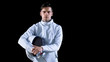 © Gorodenkoff - Portrait Shot of a Young Fencer Standing and Looking into Camera. Shot Isolated on Black Background.