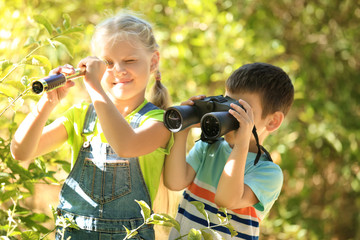 Poster - Cute children with binoculars and spyglass outdoors