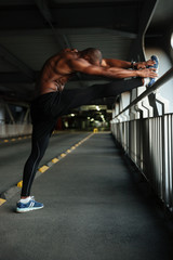 Wall Mural - Full length portrait of a motivated young muscular african sportsman