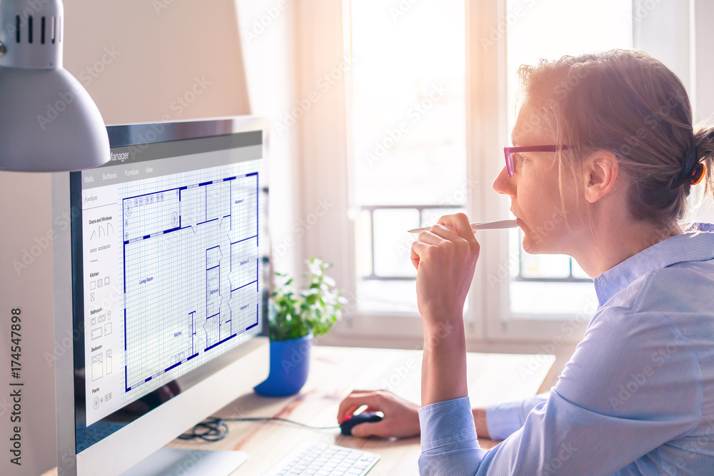 Architect designing blueprint floor plan sketch on computer ...