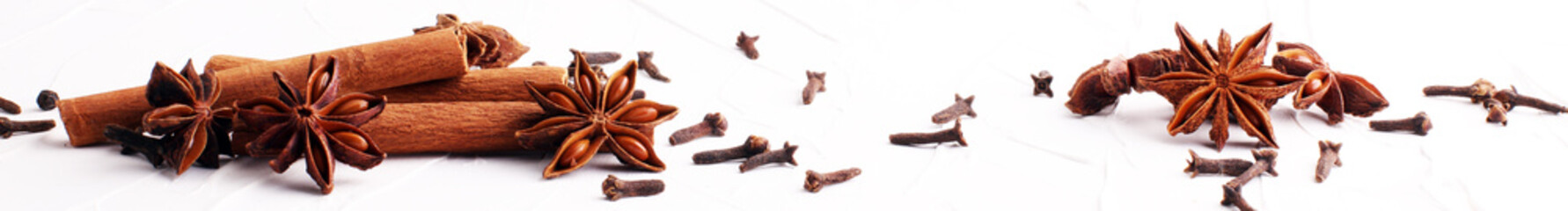 cinnamon, staranise and cloves. winter spices on white background