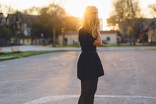 Beautiful Blond Woman At Sunset In The City