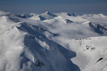 Aerial landscape view of the mountains. Taken far remote North West from Vancouver, British Columbia, Canada.