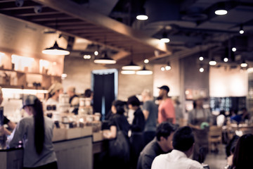 Wall Mural - Blur coffee shop or cafe restaurant with abstract bokeh light.background idea