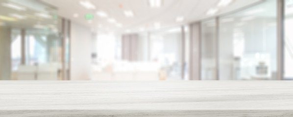 Marble stone tabletop and blurred bokeh office interior space background - can used for display or montage your products.