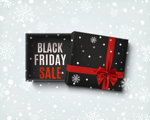 Sticker - Black Friday sale design. Opened black gift box with red bow.