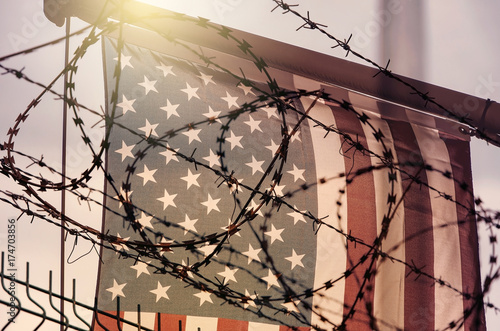 Fotografía American flag and barbed wire, USA border