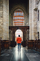 Young girl standing in a church