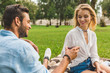 © LIGHTFIELD STUDIOS - couple clinking glasses of wine on date