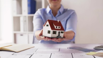 Poster - female architect with house model and blueprint