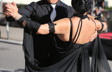 Woman With Dark Dress Dancing With A Man On The Street