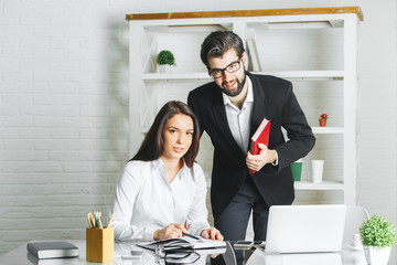 Canvas Print - Attractive man and woman working on project