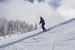 Skier on a slope with helmet