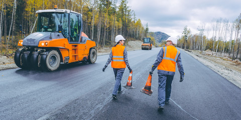 cone worker asphalting