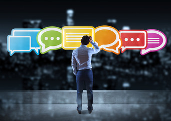Wall Mural - businessman watching social network interface on a rooftop 3d rendering