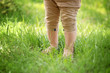 © Africa Studio - Little child walking on green grass in park