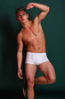 © be free - Guy or macho with strong muscles balancing on one leg.