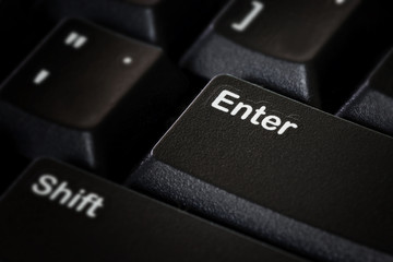 Enter button on black computer keyboard; Macro photo