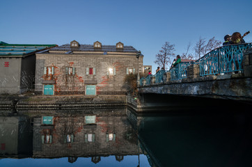 Wall Mural - Otaru, Japan- 13 NOV 2015: Otaru Canal was once a central part of the city's busy port in the first half of the 20th century. This historic canal has a romantic, old-timey ambiance.