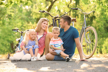 Wall Mural - Happy family in park on sunny day