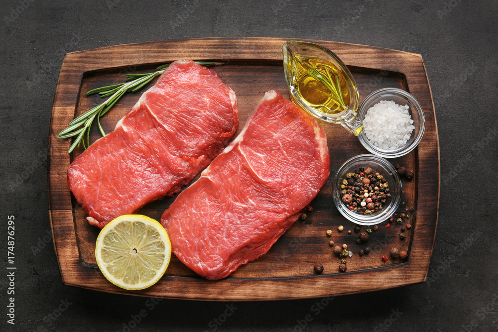 Fresh raw meat on wooden board