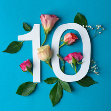 Composition With Number 10 And Beautiful Flowers On Color Background
