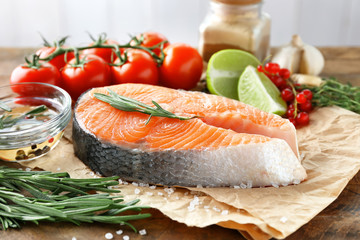 Wall Mural - Fresh salmon steak on wooden table