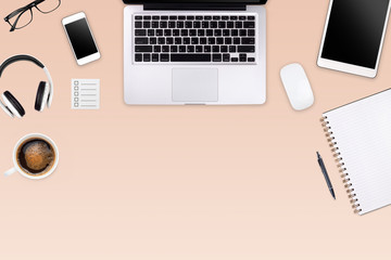 Wall Mural - Modern workspace with laptop tablet, smartphone and coffee cup copy space on color background. Top view. Flat lay style.