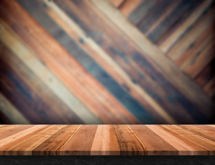 Fototapete - modern wooden table top at blurred diagonal wood plank wall,Template mock up for display or montage of product.