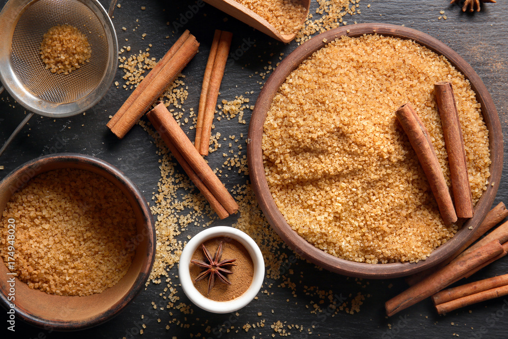 Beautiful composition with sweet cinnamon sugar on table