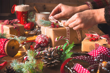 Wall Mural - Female hands wrapping christmas holiday handmade presents