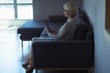 © wavebreak3 - Side view of businesswoman using digital tablet