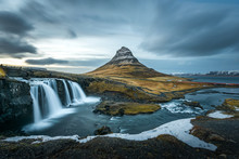 Beautiful Landscape Of Kirkjufellsfoss With Background Of Remarkable Mountain, Landmark Of Iceland During Late Winter