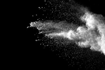 Explosion of white dust on black background.