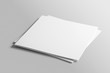© PrimeMockup - Blank square photorealistic brochure mockup on light grey background.