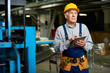 © Seventyfour - Portrait of senior factory worker using digital tablet looking away, copy space